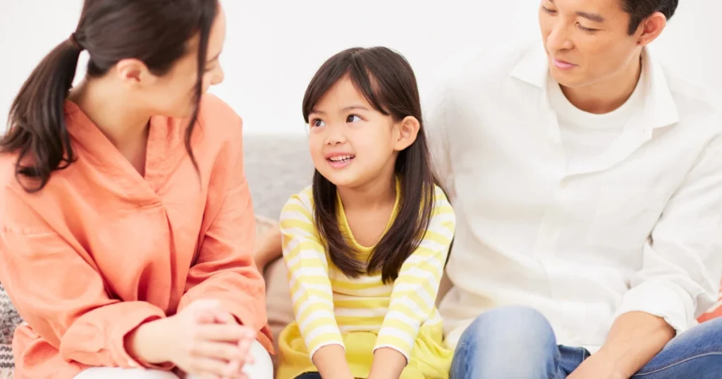 Parents talking with their child while deciding whether homeschooling is the right fit