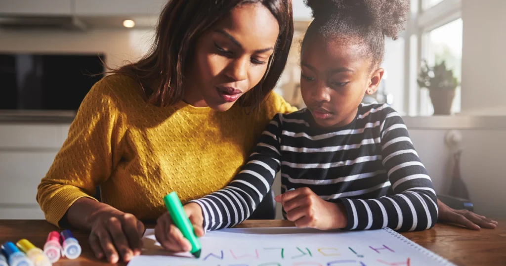 Parent and child working together one-on-one during homeschool hours at home