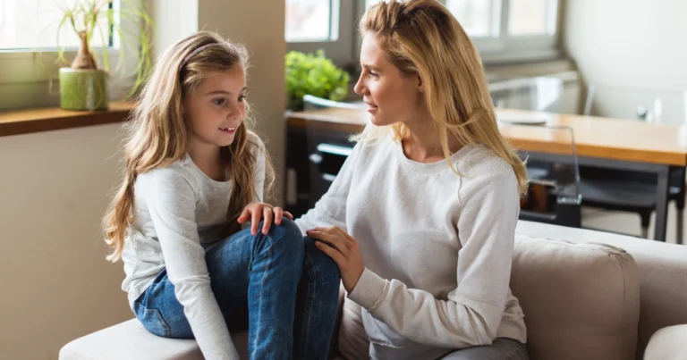 Parent talking with child at home about homeschooling decision
