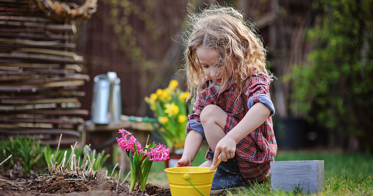 Child exploring nature and gardening during a learning reset