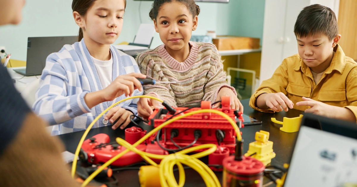 Homeschooled children working together on a science project in a homeschool co-op.